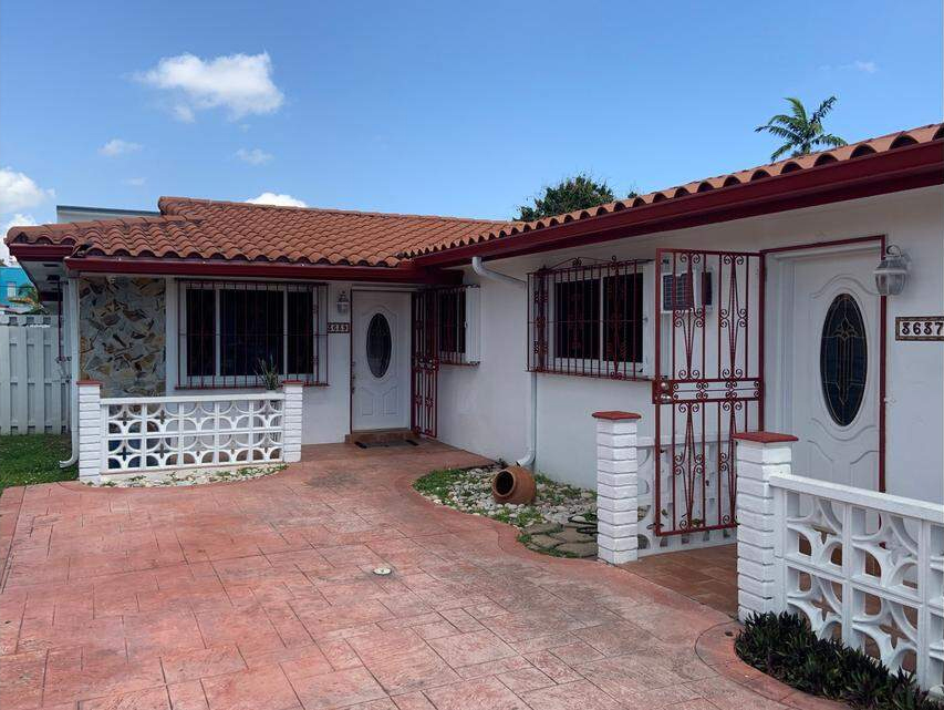 Exterior photo of two connected residences